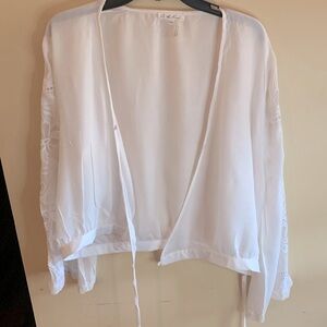 White bell sleeve topper with beautiful insert design. Endless ways to style it!